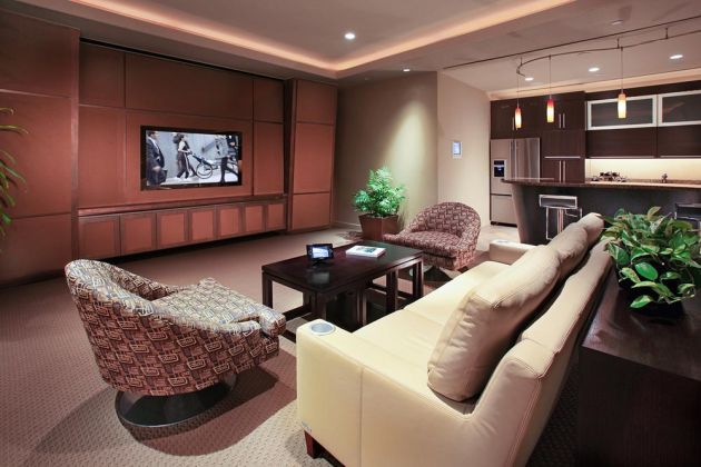 Living room with television on wood wall