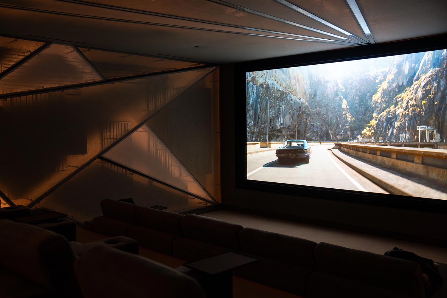 Side view of home theater with acoustic wall panels and screen