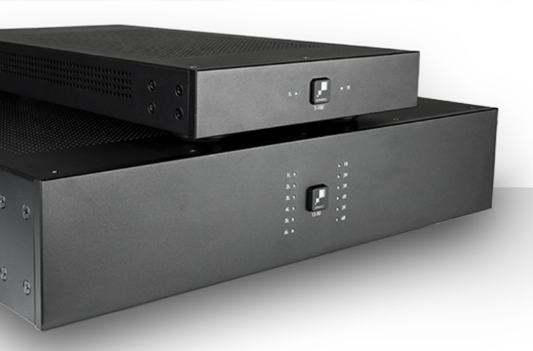 Close-up of Sonance commercial amplifiers stacked, showcasing the sleek design and front panel controls.