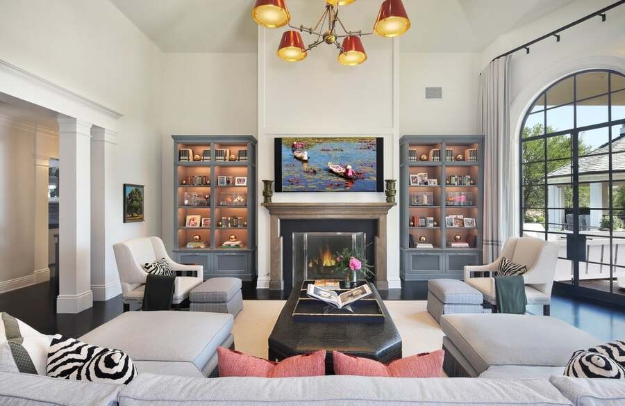 A luxurious living room with smart lights and an AV setup.