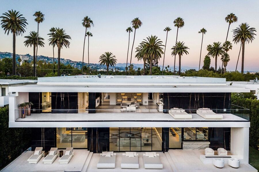 A modern luxury home with a window view of skyscrapers. 