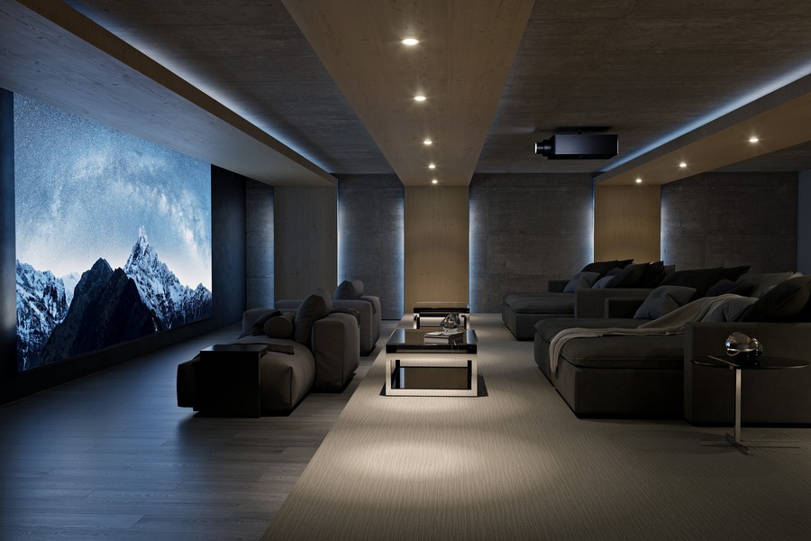 A luxury home theater with a Sony projector displaying a snowy landscape.