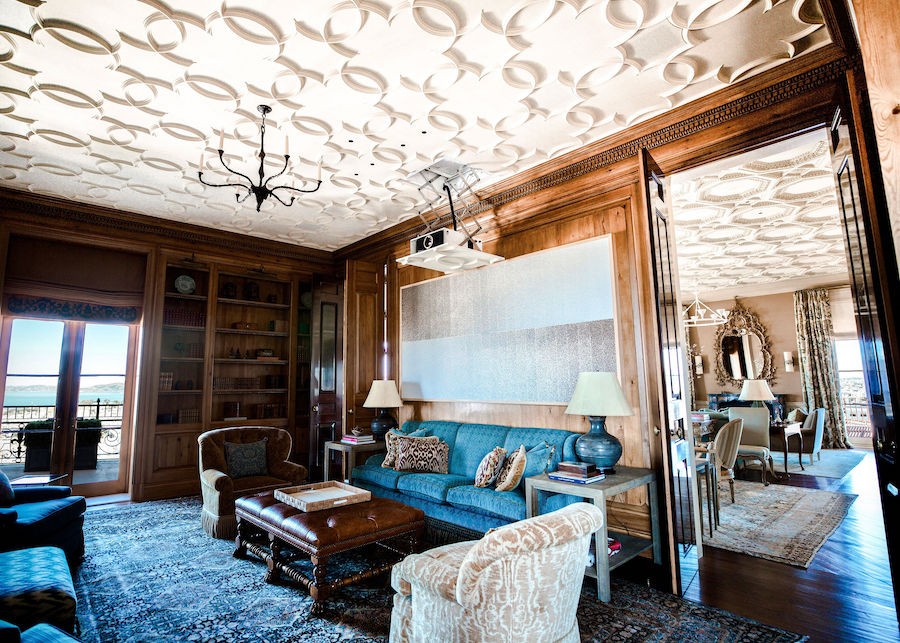 Projector descends from an ornate ceiling in an automated lift. 