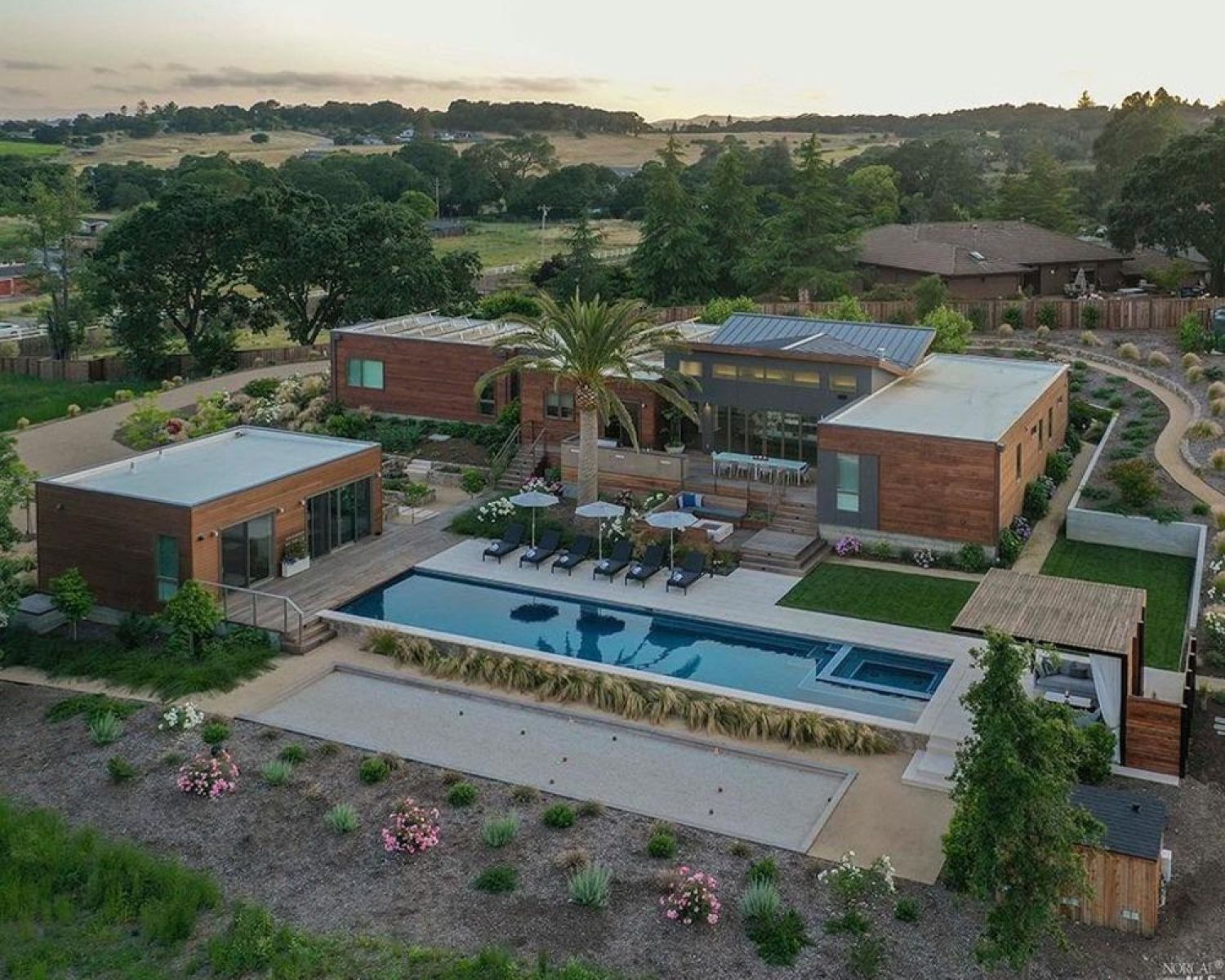 aerial view of modern home with pool