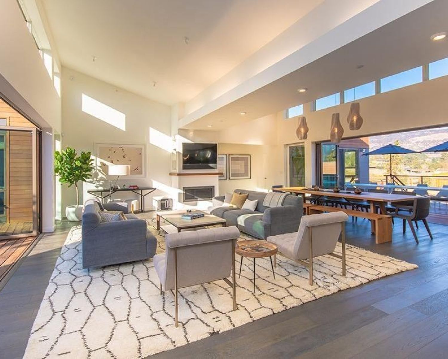 living area with open doors leading to outside