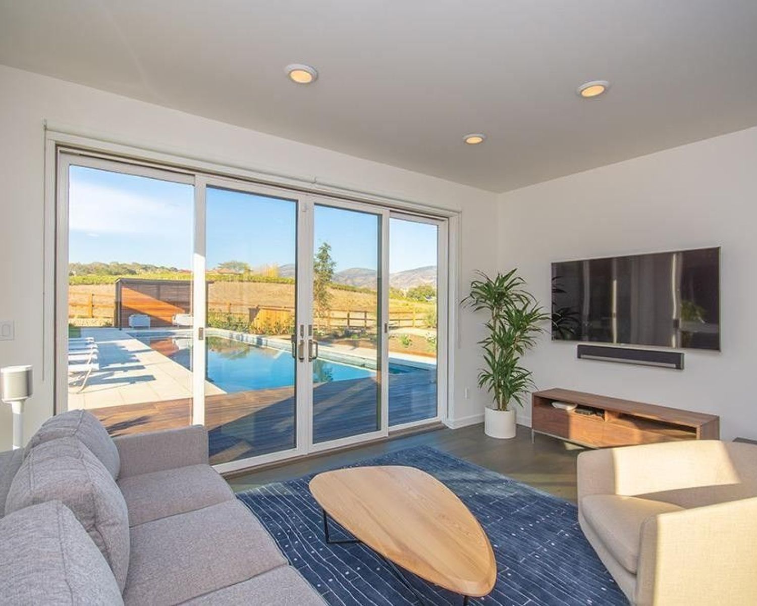 living room with sliding glass doors and white walls