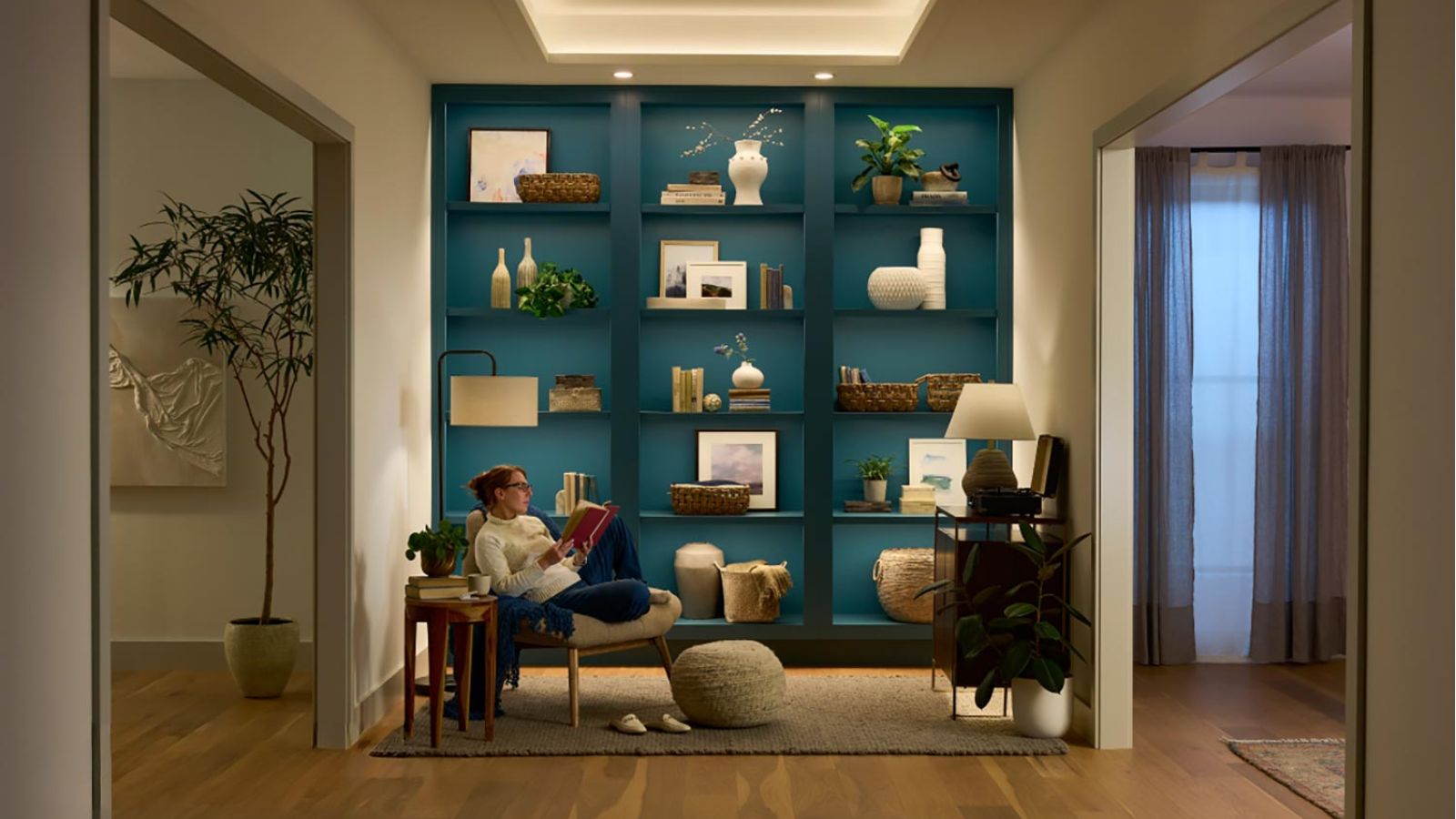 Cozy reading nook with built-in shelves and layered lighting