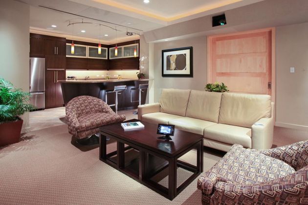 AUDIOVISIONS Sitting room with cream couch