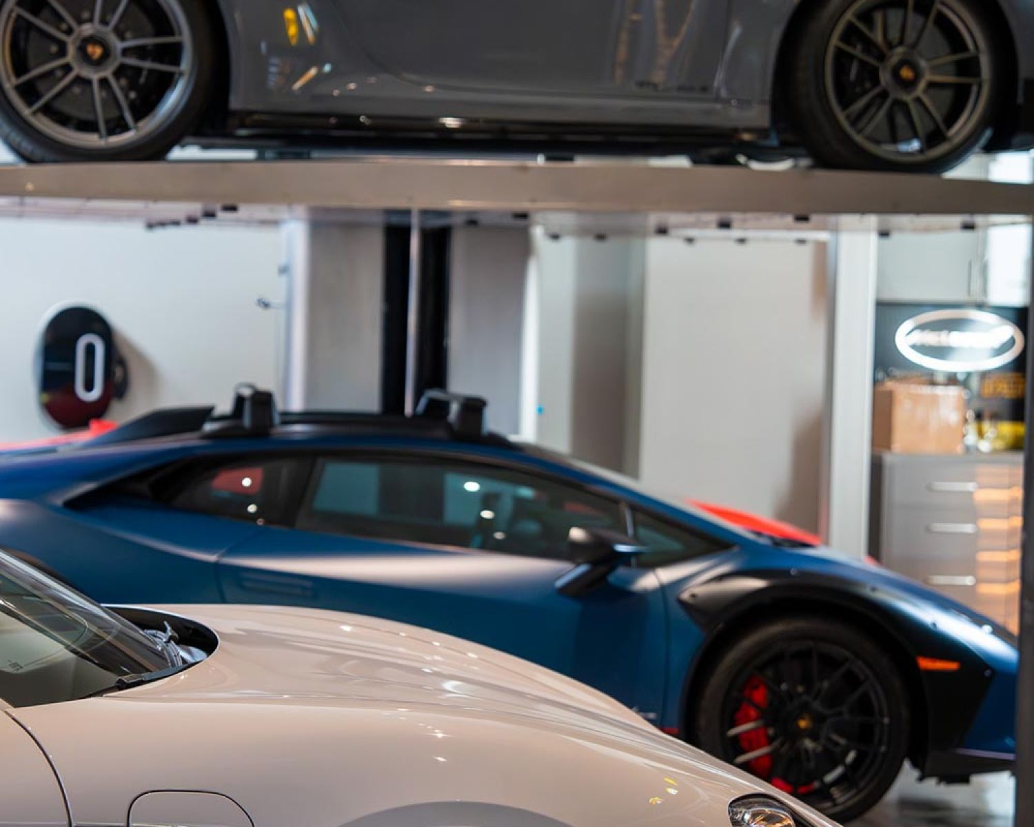 Close view of a sports car elevated on a garage lift