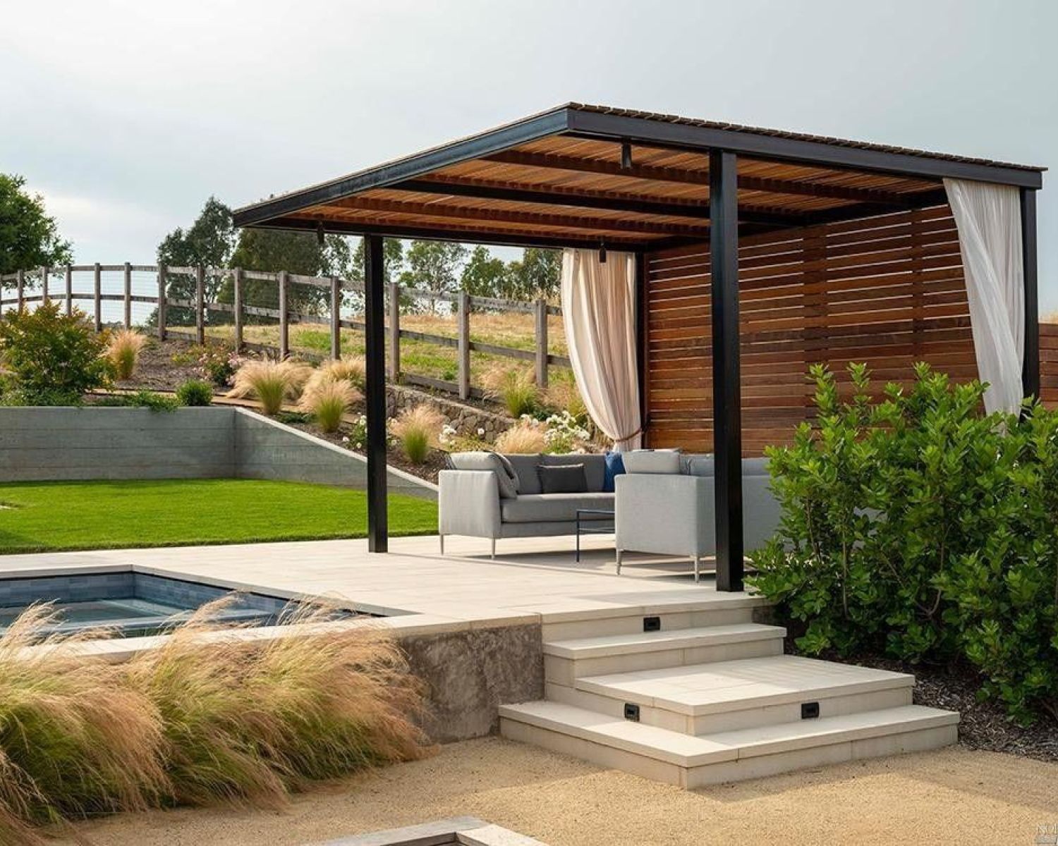 wooden pergola with steps leading to pools