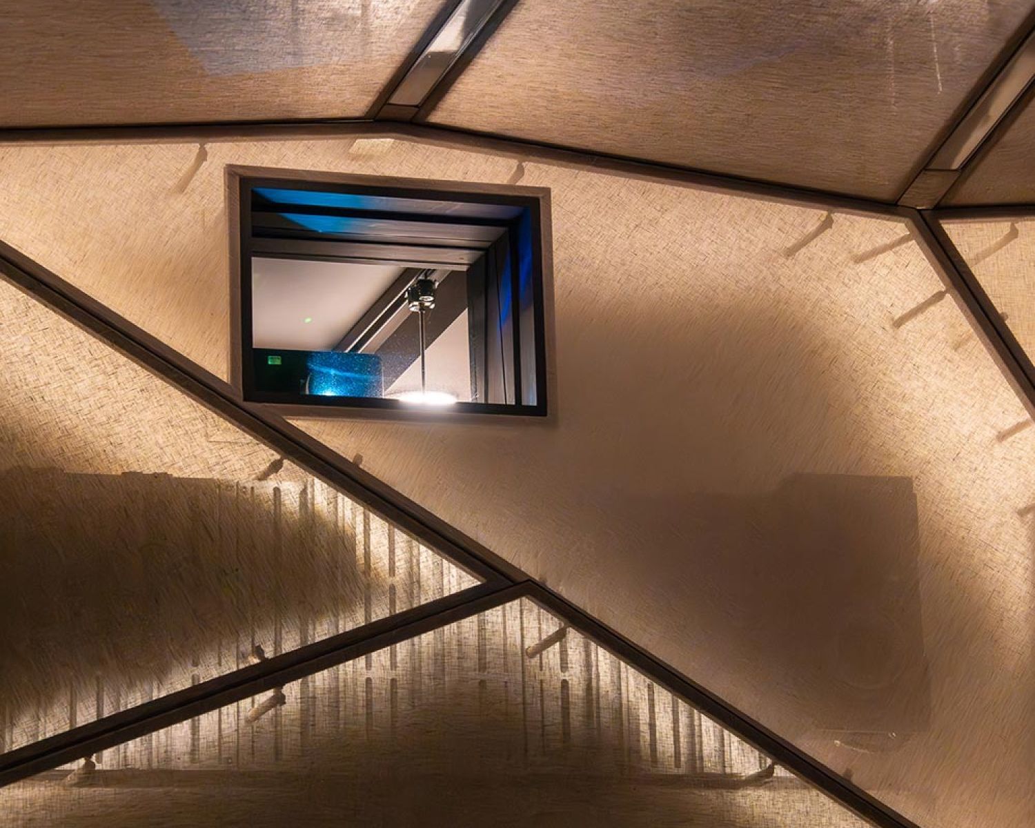 Ceiling detail with linear lighting above home theater screen