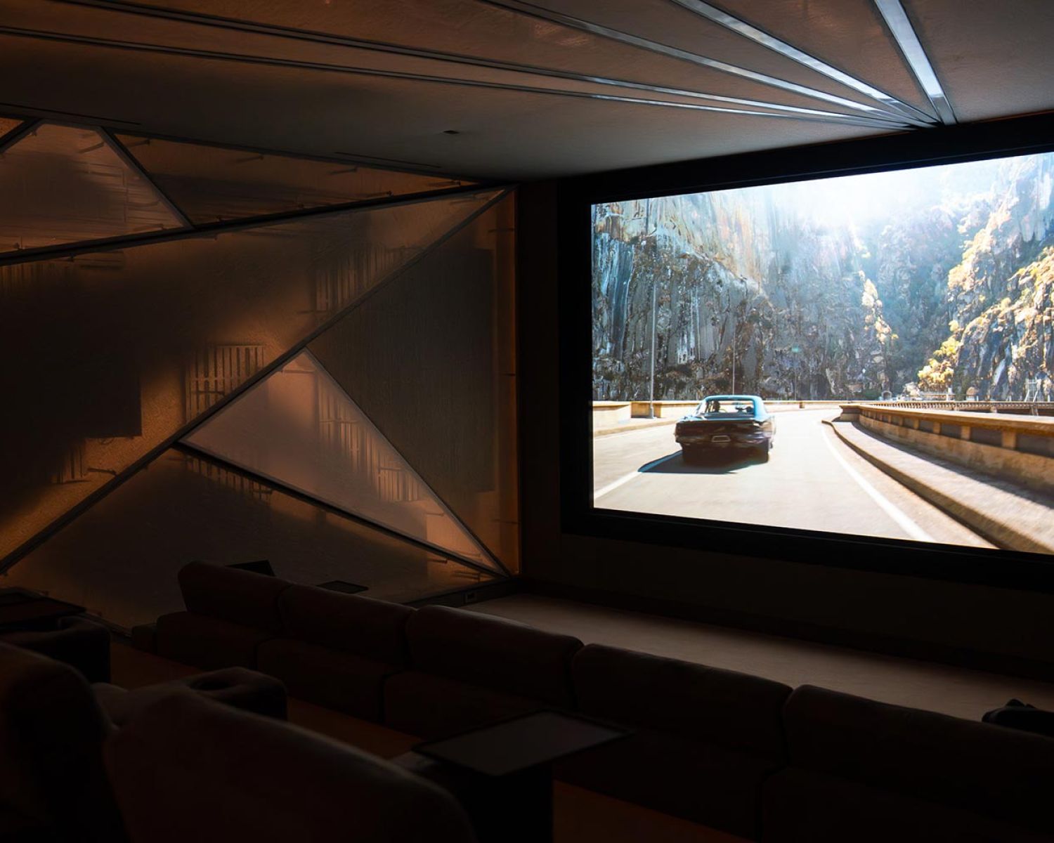 Side view of home theater with acoustic wall panels and screen