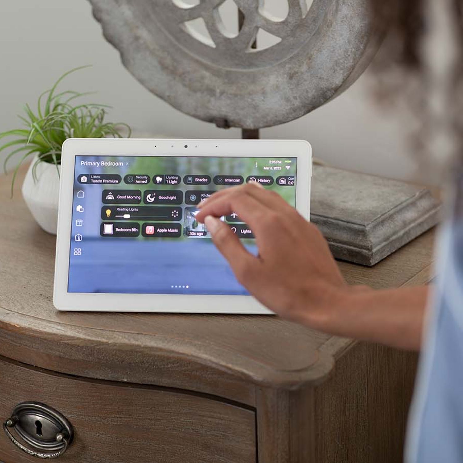 Control4 Touch Panel sitting on a pile of books