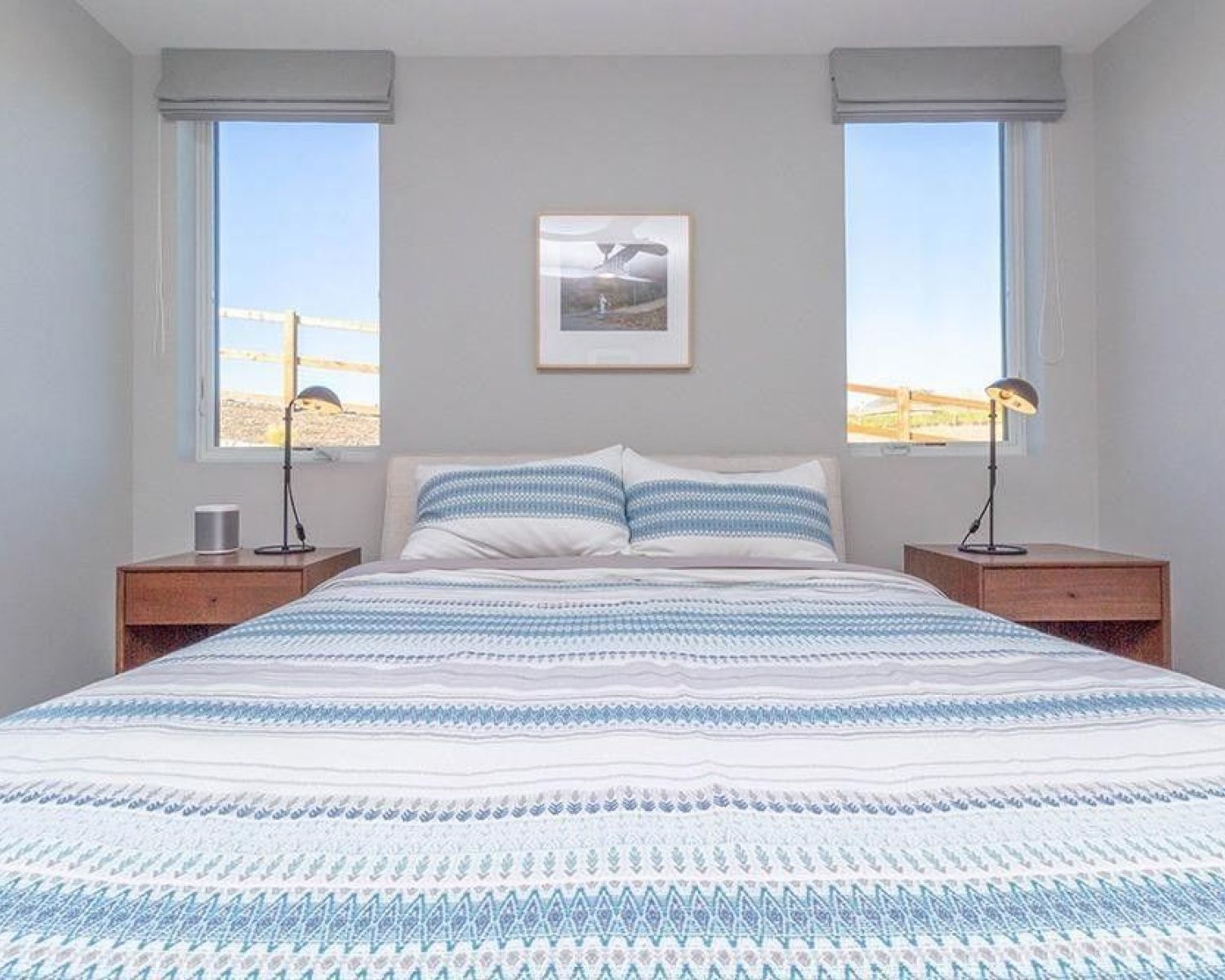 bedroom with lutron window treatments